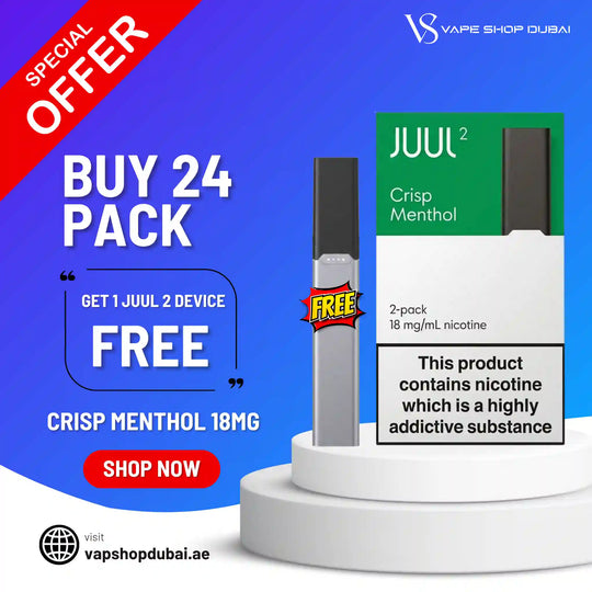 Promotional graphic for a JUUL 2 disposable vape device in Crisp Menthol flavor, showing a single silver and black vape pen beside its green and white packaging on a white pedestal. Large text advertises a 24-pack deal and a free device, with the brand name Vape Shop Dubai visible.