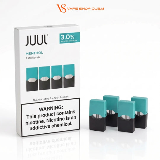 A box of JUUL Menthol 4 JUUL pods alongside four individual pods showing their teal and black color scheme, on a clean white background with a reflection.