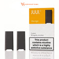 Two black JUUL 2 disposable vape devices shown next to their orange and white packaging box labeled 'Mango' on a white background. The image includes a 'VS Vape Shop Dubai' watermark at the top.