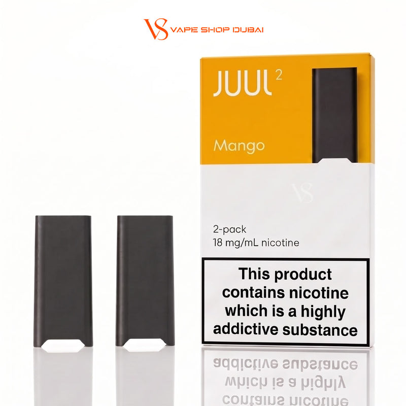 Two black JUUL 2 disposable vape devices shown next to their orange and white packaging box labeled 'Mango' on a white background. The image includes a 'VS Vape Shop Dubai' watermark at the top.