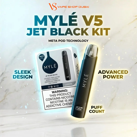 MYLE V5 Jet Black Kit vape pod and its retail box on a light marble-textured background with promotional text including 'MYLÉ V5 JET BLACK KIT', 'META POD TECHNOLOGY', 'SLEEK DESIGN', 'ADVANCED POWER', and 'PUFF COUNT'.