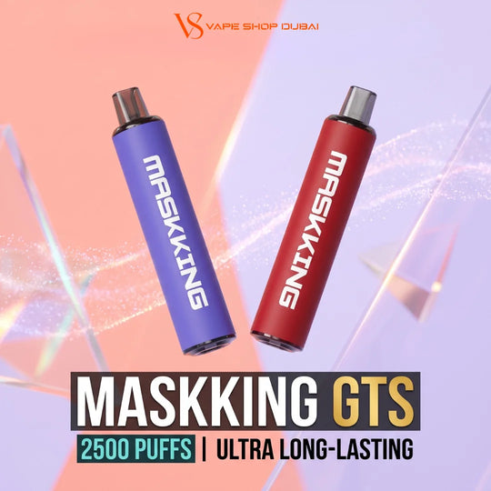 Two vape devices, one purple and one red, both branded MASKKING, floating against a pastel pink, orange, and lavender graphic background with text overlays reading MASKKING GTS, 2500 PUFFS, and ULTRA LONG-LASTING. The top of the image features the 'VS VAPE SHOP DUBAI' logo.