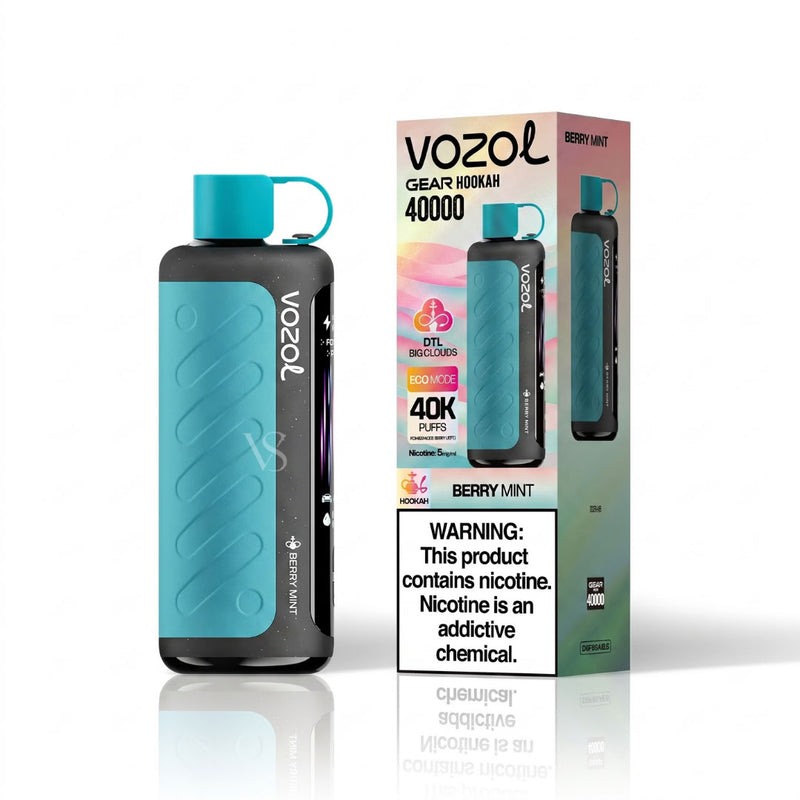 Vozol Gear Koomi 40000 disposable vape device in Berry Mint flavor, shown next to its retail packaging box on a reflective white background.
