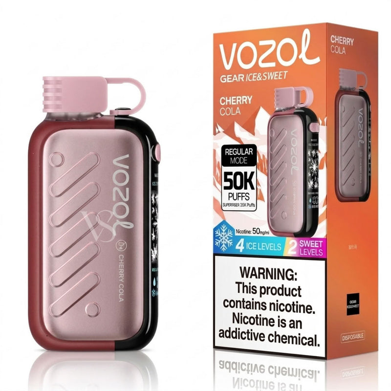 Vozol GEAR Ice & Sweet Cherry Cola disposable vape device next to its orange retail packaging box, featuring a metallic rose gold body with dark red accents and a pink mouthpiece.