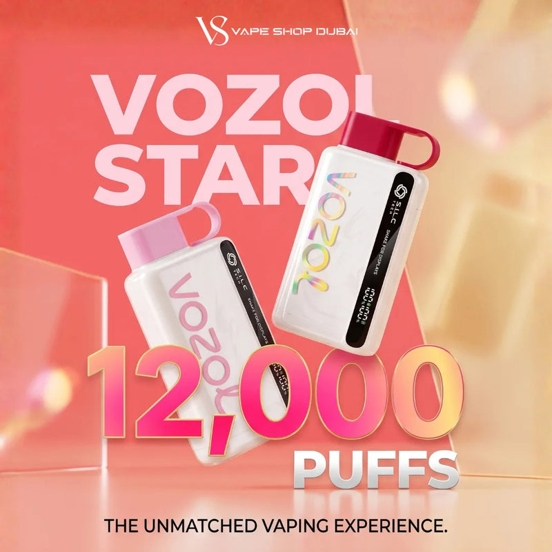 Promotional graphic for Vozol Stars disposable vapes by Vape Shop Dubai, showing two white vapes with pink and red caps against a warm pink and orange gradient background with large text reading 'VOZOL STARS' and '12,000 PUFFS'.